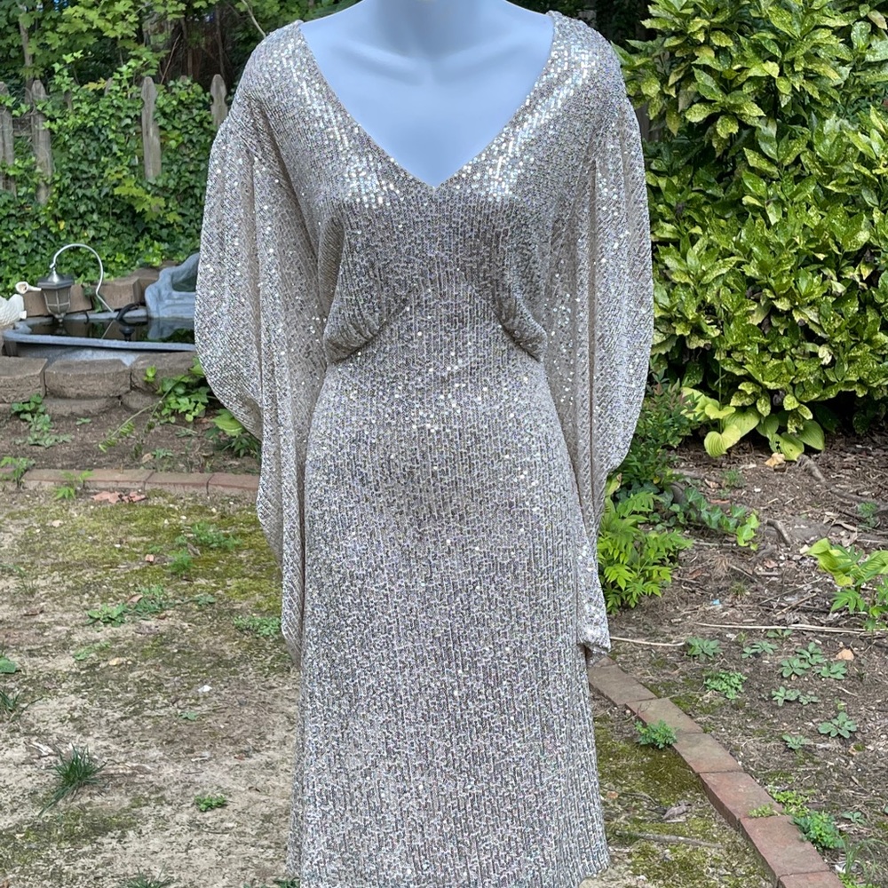 Puff sleeve sequin cocktail dress.
